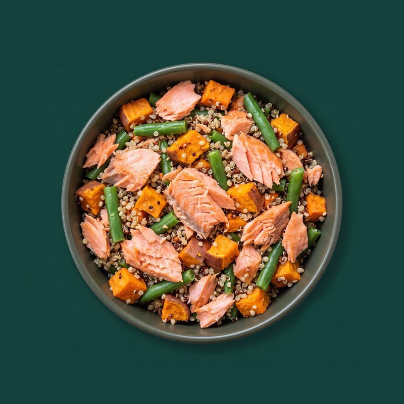 Salmon and Sweet Potato topper in a charcoal bowl — flaked salmon with sweet potato and peas